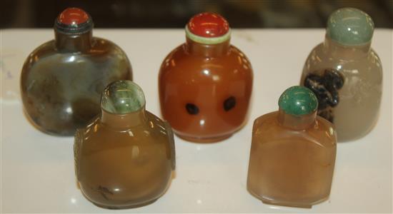 Five Chinese agate snuff bottles, one carved with insects, one with handles